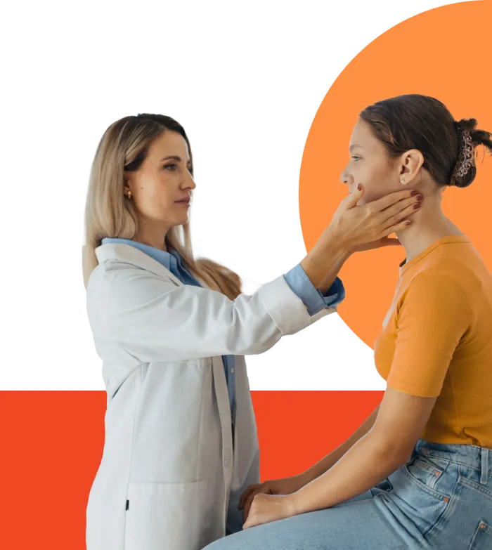 A female doctor in a white coat gently examines a young woman’s throat and neck. The patient, wearing an orange shirt and jeans, sits on an exam table. The background features abstract orange and red shapes.