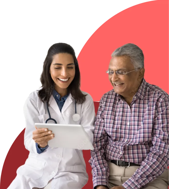 A smiling doctor in a white coat holds a digital tablet while sitting next to an elderly man in glasses and a plaid shirt; both look at the tablet together, engaged and happy, highlighting the benefits of modern Health Services against a pink and red abstract background.