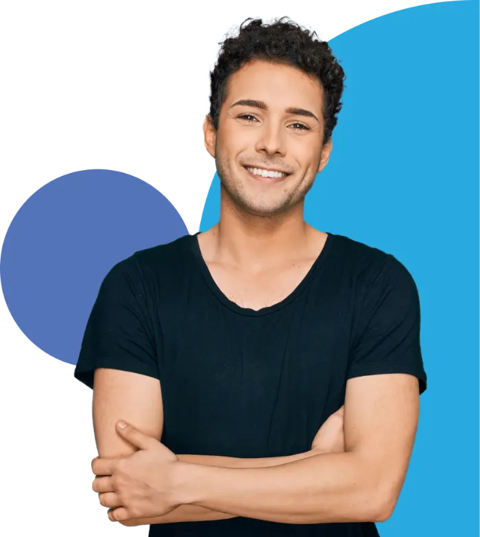 A young man with curly brown hair is smiling and standing with his arms crossed. He is wearing a black t-shirt. The background features abstract blue shapes.