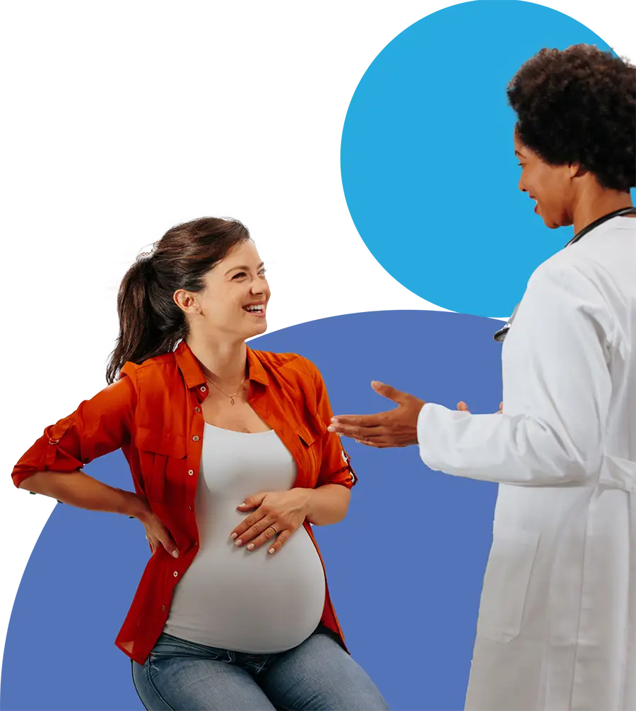 A pregnant woman in a red shirt and jeans smiles and talks with a female doctor in a white coat. The woman holds her belly while the doctor gestures with her hands. The background features abstract blue shapes.