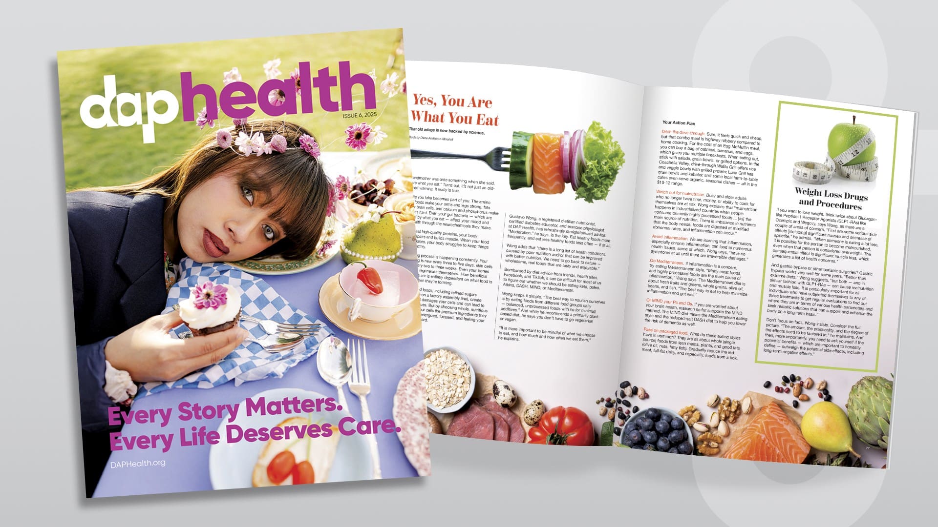 A DAP Health magazine lies open on a light surface. The cover shows a woman with a flower crown at a picnic, with the headline, "Every Story Matters. Every Life Deserves Care." The open pages display healthy foods and articles about nutrition.