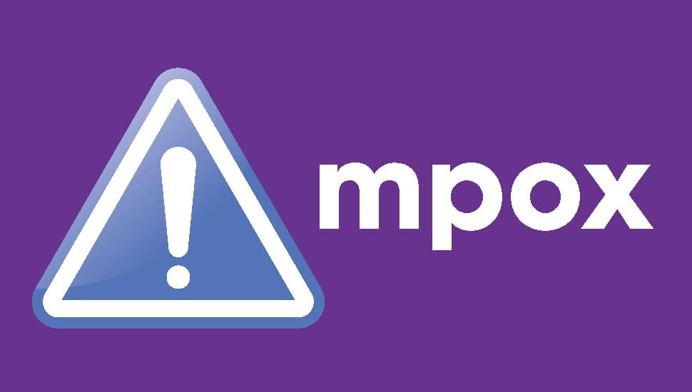 A purple background with a white exclamation mark inside a blue-bordered triangle on the left, and the bold white text “mpox” to the right of the triangle, indicating a health warning or alert about mpox.