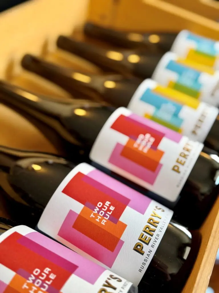 Rows of Perry’s Two Hour Rule wine bottles in a wooden case